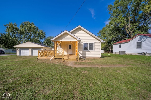 2682 E 150 S, Anderson, IN 46017 - bungalow featuring a detached garage, covered porch, and a front lawn