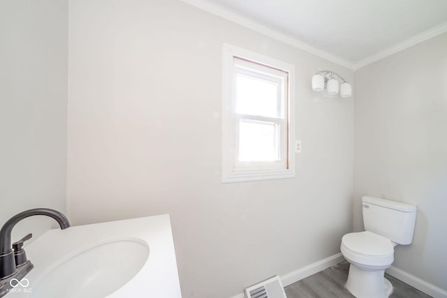 2682 E 150 S, Anderson, IN 46017 - half bath featuring ornamental molding, wood finished floors, and vanity