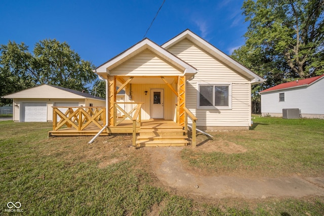 2682 E 150 S, Anderson, IN 46017 - view of front of property with a front yard, a detached garage, and covered porch