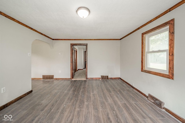 2682 E 150 S, Anderson, IN 46017 - empty room with crown molding, arched walkways, and wood finished floors