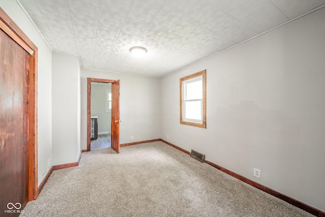 2682 E 150 S, Anderson, IN 46017 - unfurnished bedroom with carpet, multiple windows, and a closet