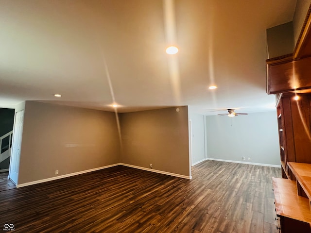 unfurnished living room with ceiling fan and dark hardwood / wood-style floors