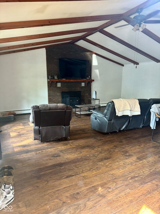 living room with ceiling fan, vaulted ceiling with beams, a fireplace, and dark hardwood / wood-style flooring