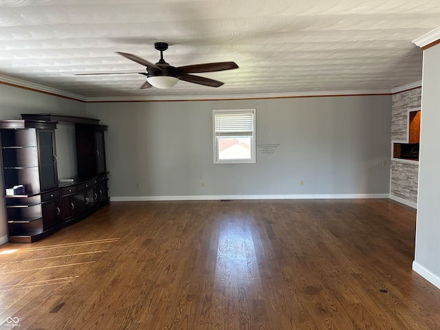 unfurnished living room with ornamental molding and dark hardwood / wood-style flooring