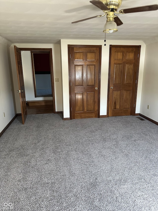 unfurnished bedroom with carpet and ceiling fan