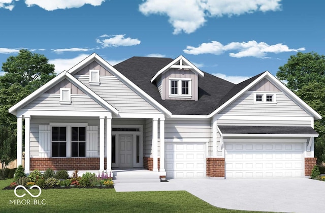 view of front of home with covered porch, a front yard, and a garage