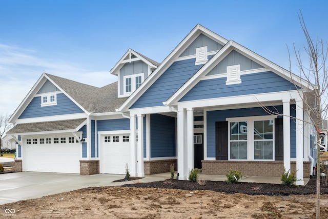 craftsman house with a garage