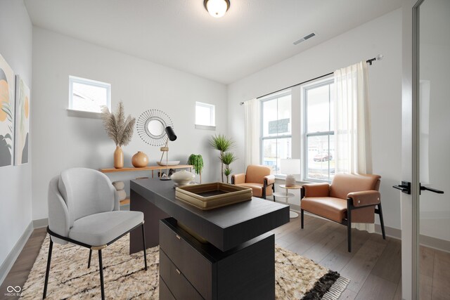 office area featuring plenty of natural light and light hardwood / wood-style floors