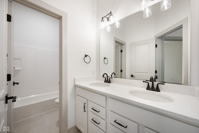 bathroom with vanity, toilet, and tile patterned flooring