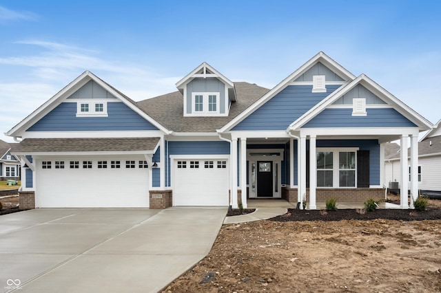 craftsman-style home with a garage and covered porch