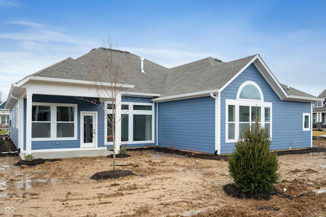 rear view of property featuring a patio