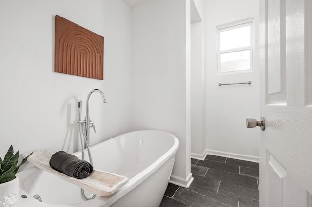 bathroom with a tub to relax in