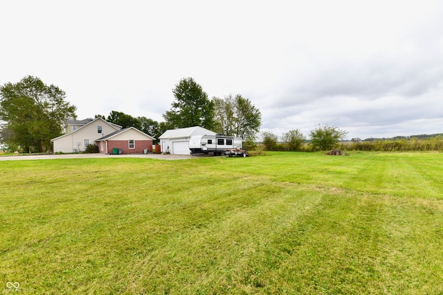 view of yard featuring a garage