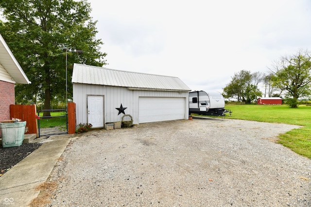 garage featuring a yard