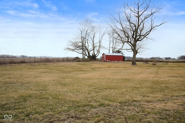 view of yard with a rural view