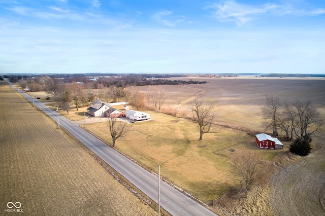 birds eye view of property with a rural view