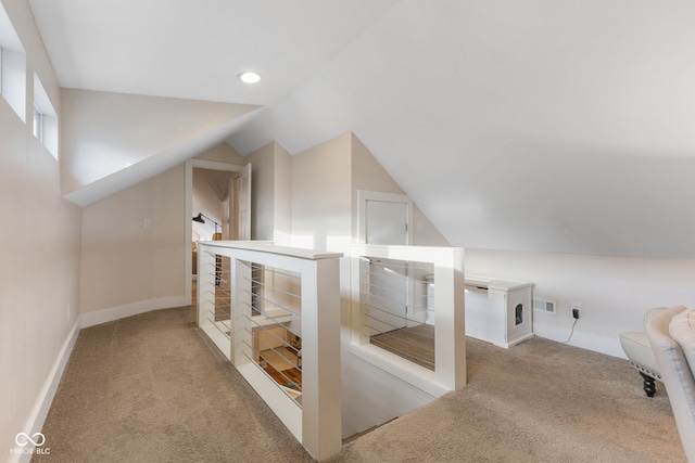 additional living space with carpet floors and lofted ceiling