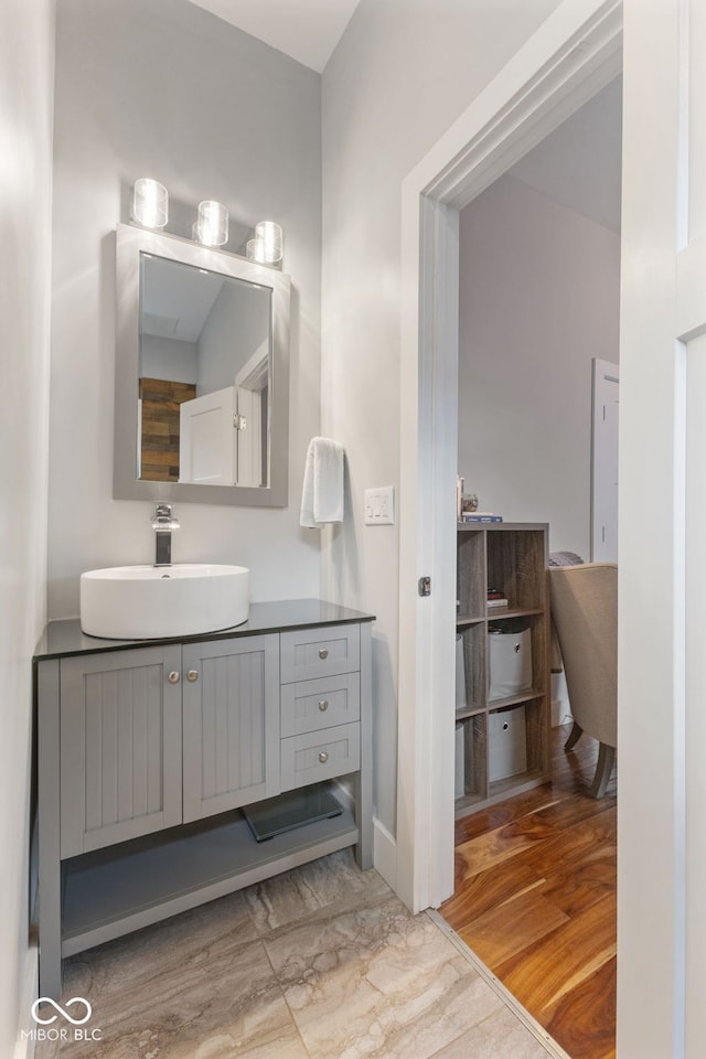 bathroom featuring wood-type flooring and vanity