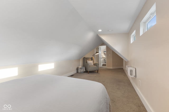 bedroom featuring light carpet and lofted ceiling