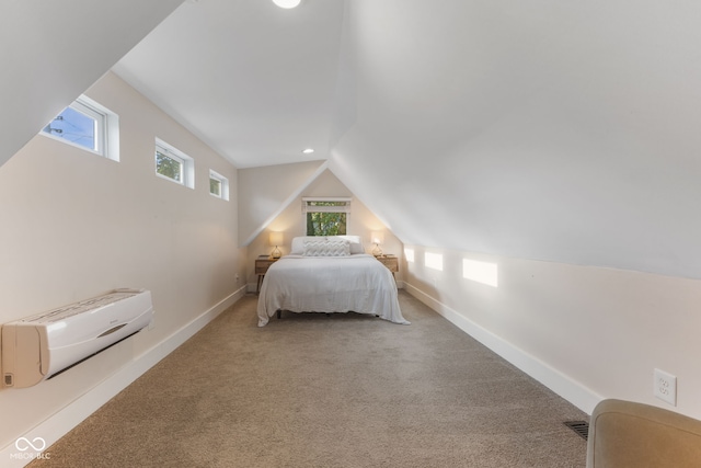 bedroom with carpet flooring, vaulted ceiling, and an AC wall unit