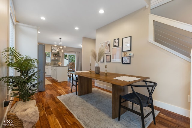 home office featuring a chandelier and dark wood-type flooring