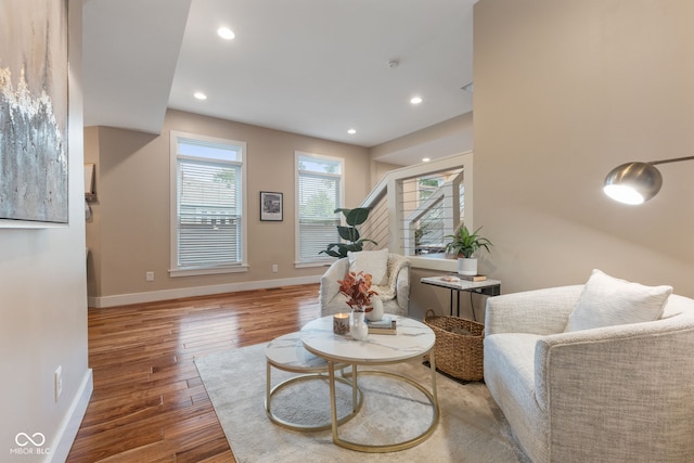 living area with hardwood / wood-style floors