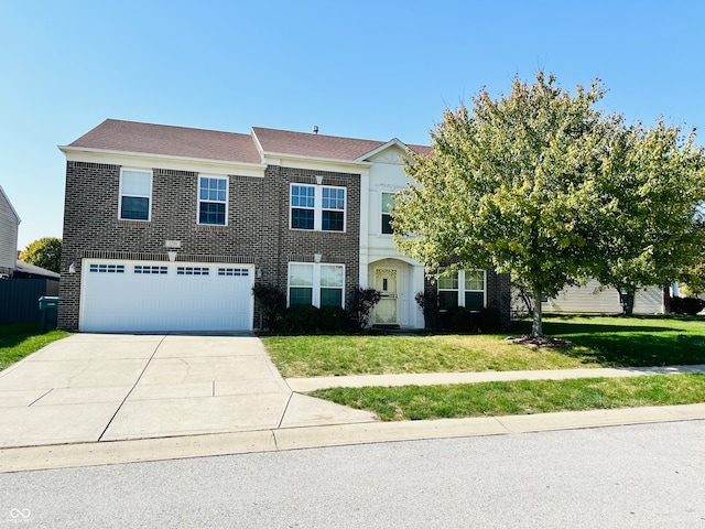 view of front of property with a garage and a front yard