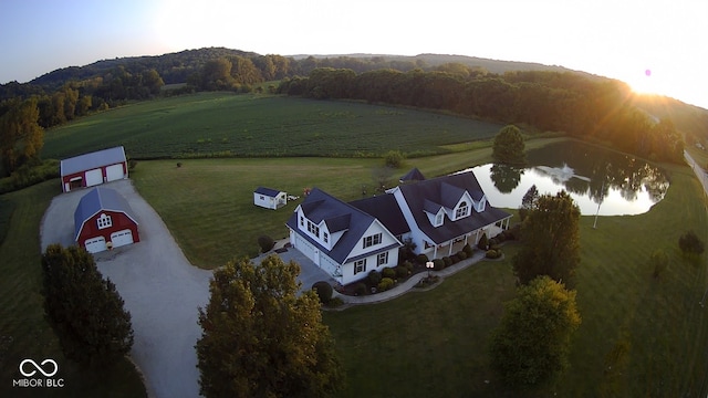 aerial view with a water view and a rural view