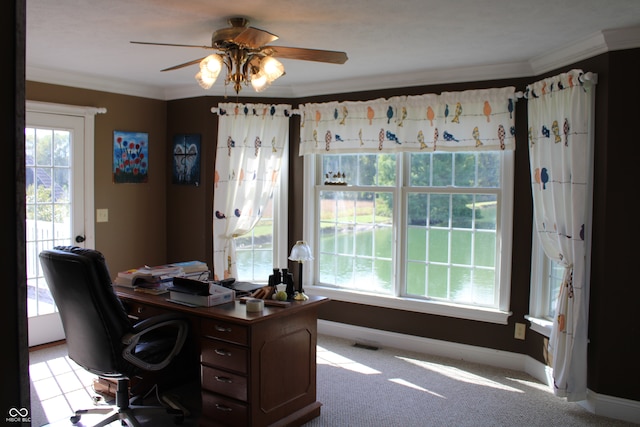 office space featuring ceiling fan, light colored carpet, and ornamental molding