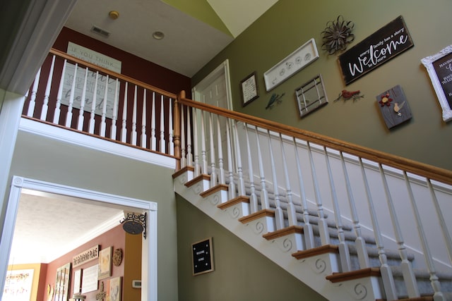 staircase with crown molding