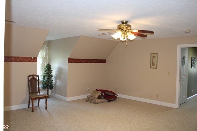 unfurnished room with vaulted ceiling, ceiling fan, and light colored carpet