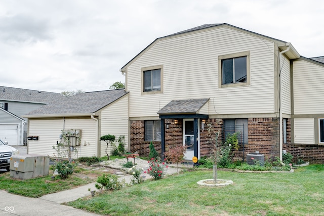 view of front of house with a front yard and a garage