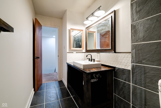 bathroom with vanity and tasteful backsplash