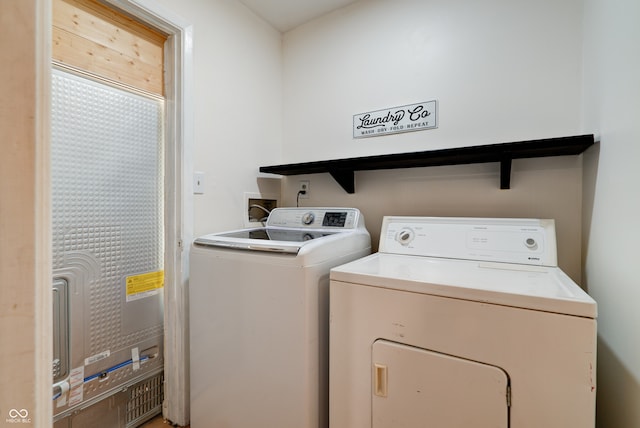 laundry room with separate washer and dryer