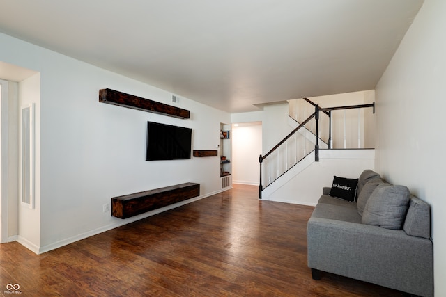 unfurnished living room featuring dark hardwood / wood-style flooring