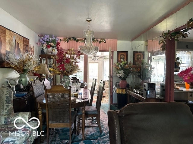 dining area featuring a chandelier