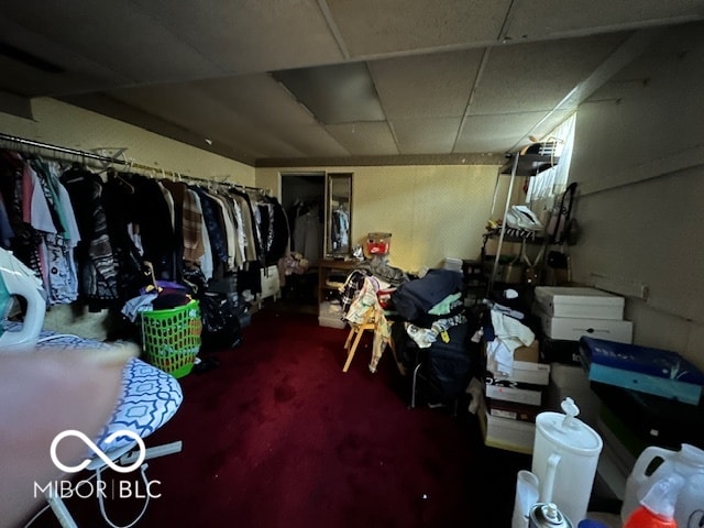 basement featuring a drop ceiling