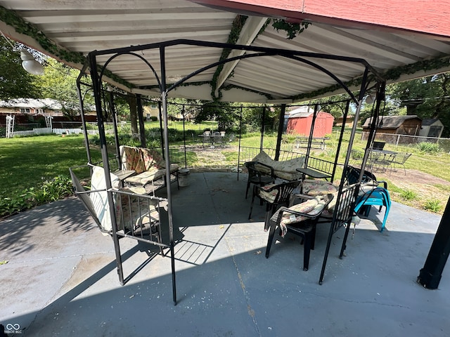 view of patio with a gazebo and a storage unit