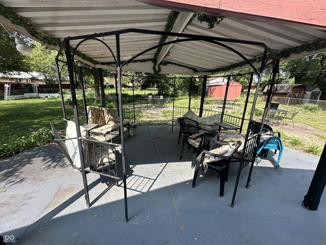 4434 E 46th St, Indianapolis, IN 46226 - view of patio with outdoor dining area, fence, an outbuilding, and a shed