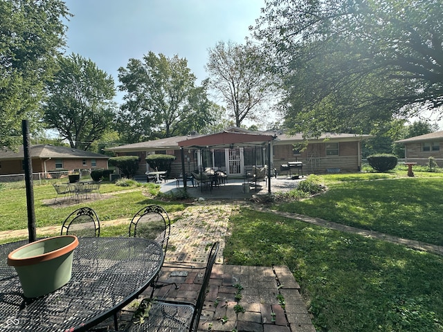 exterior space with a patio and a lawn