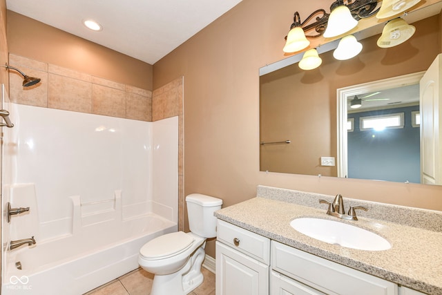 full bathroom with shower / tub combination, tile patterned floors, vanity, and toilet