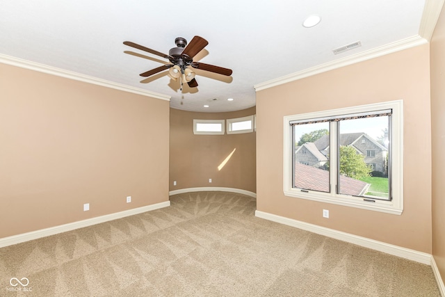 unfurnished room with ceiling fan, carpet floors, and ornamental molding