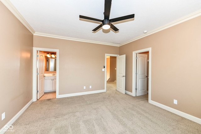 unfurnished bedroom featuring ornamental molding, light colored carpet, ensuite bathroom, and ceiling fan