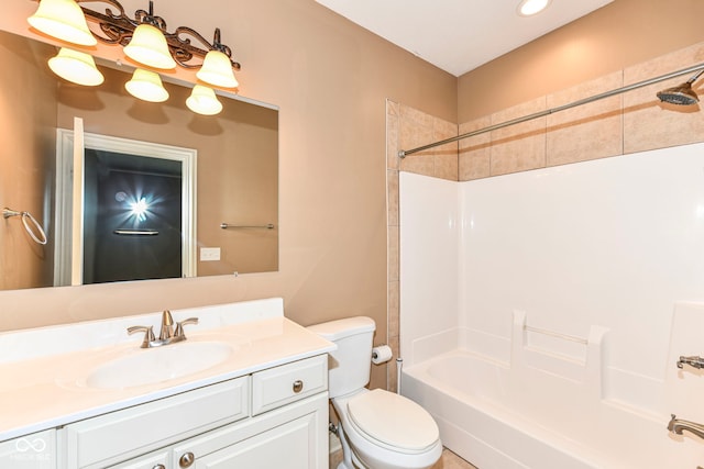 full bathroom with shower / bathtub combination, vanity, and toilet