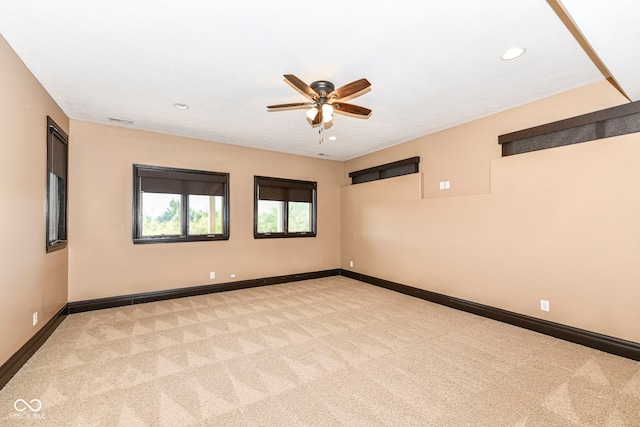 carpeted empty room with ceiling fan