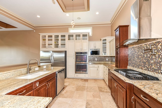 kitchen featuring light stone countertops, tasteful backsplash, wall chimney range hood, hanging light fixtures, and appliances with stainless steel finishes