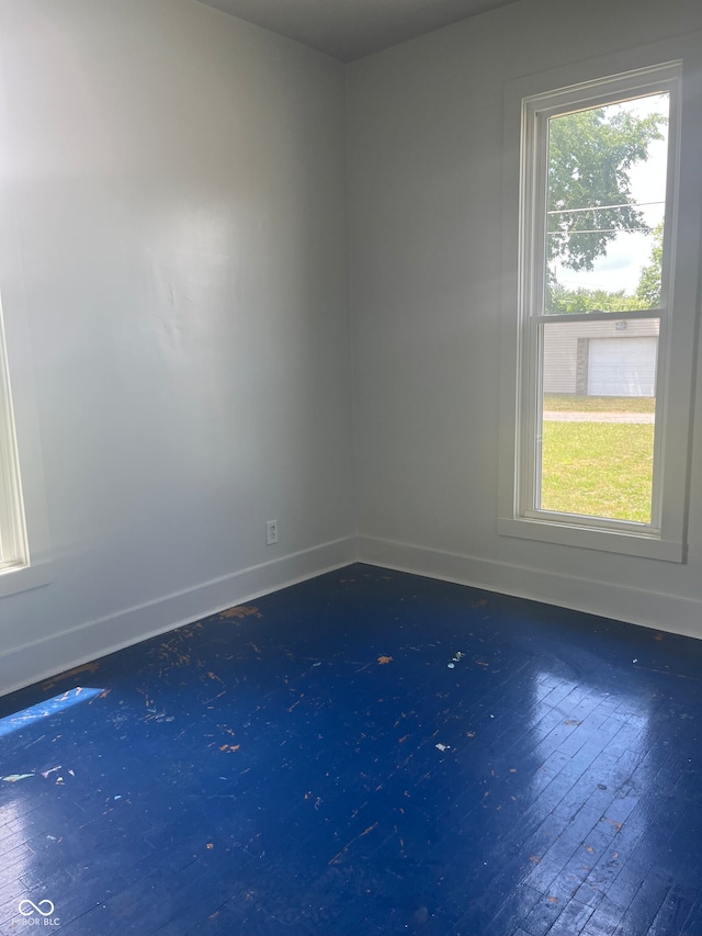 unfurnished room featuring wood-type flooring