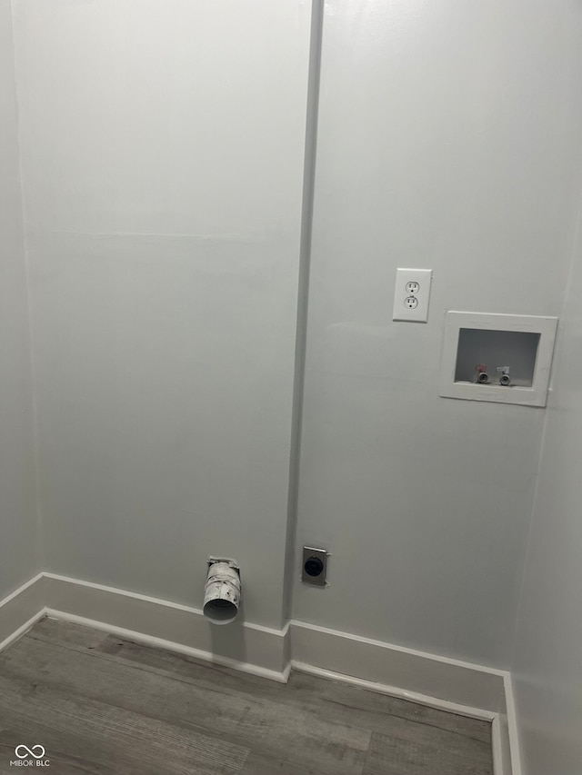 clothes washing area featuring hookup for an electric dryer, dark hardwood / wood-style flooring, and washer hookup