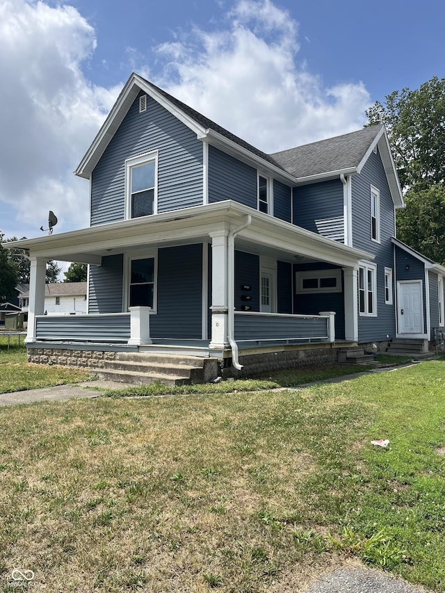 view of front of property featuring a front lawn and covered porch