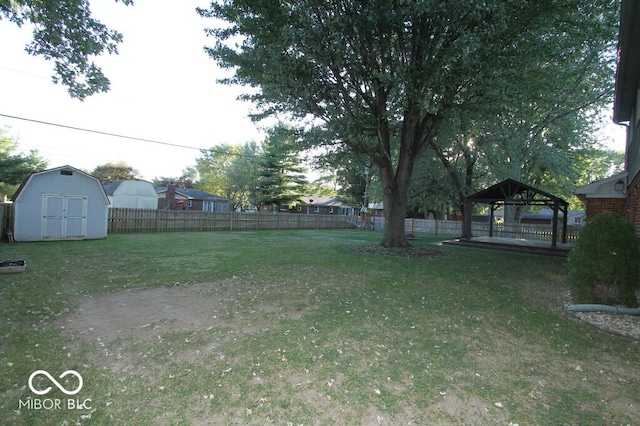 view of yard featuring a gazebo and a storage shed